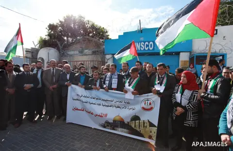 Palestinian lawyers take part in a protest following Trump's decision to recognise Jerusalem as the capital of Israel, in front of the headquarter United Nation "UNSCO" in Gaza City, on December 7, 2017. Photo by Mahmoud...