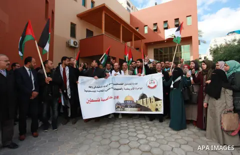 Palestinian lawyers take part in a protest following Trump's decision to recognise Jerusalem as the capital of Israel, in front of the headquarter United Nation "UNSCO" in Gaza City, on December 7, 2017. Photo by Mahmoud...