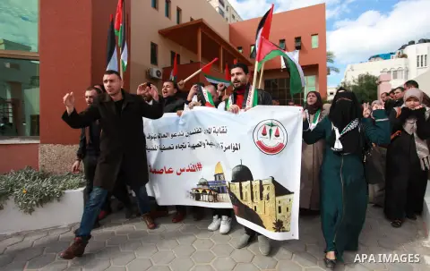 Palestinian lawyers take part in a protest following Trump's decision to recognise Jerusalem as the capital of Israel, in front of the headquarter United Nation "UNSCO" in Gaza City, on December 7, 2017. Photo by Mahmoud...