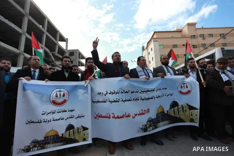 Palestinian lawyers take part in a protest following Trump's decision to recognise Jerusalem as the capital of Israel, in front of the headquarter United Nation "UNSCO" in Gaza City, on December 7, 2017. Photo by Mahmoud...