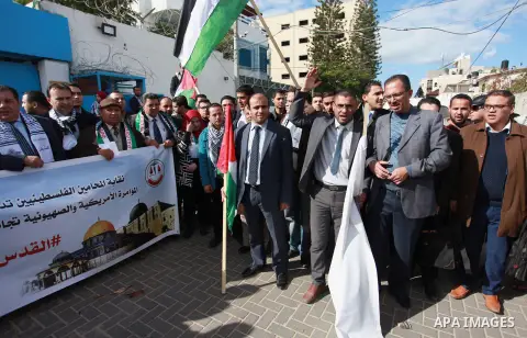 Palestinian lawyers take part in a protest following Trump's decision to recognise Jerusalem as the capital of Israel, in front of the headquarter United Nation "UNSCO" in Gaza City, on December 7, 2017. Photo by Mahmoud...