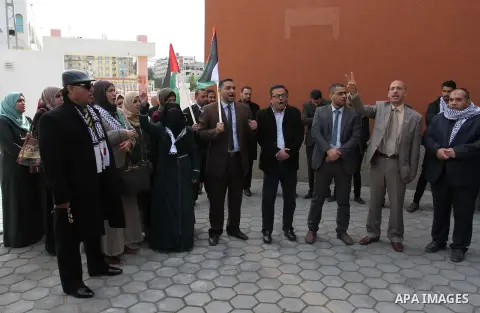 Palestinian lawyers take part in a protest following Trump's decision to recognise Jerusalem as the capital of Israel, in front of the headquarter United Nation "UNSCO" in Gaza City, on December 7, 2017. Photo by Mahmoud...