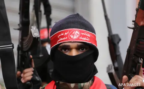 Palestinian militants from the Popular Front for the Liberation of Palestine (PFLP) take part in a protest following Trump's decision to recognise Jerusalem as the capital of Israel, in Gaza City, on December 7, 2017. Ph...