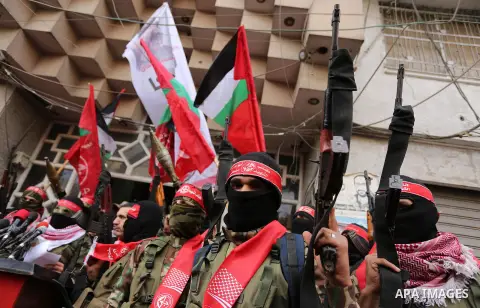 Palestinian militants from the Popular Front for the Liberation of Palestine (PFLP) take part in a protest following Trump's decision to recognise Jerusalem as the capital of Israel, in Gaza City, on December 7, 2017. Ph...