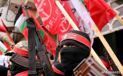 Palestinian militants from the Popular Front for the Liberation of Palestine (PFLP) take part in a protest following Trump's decision to recognise Jerusalem as the capital of Israel, in Gaza City, on December 7, 2017. Ph...