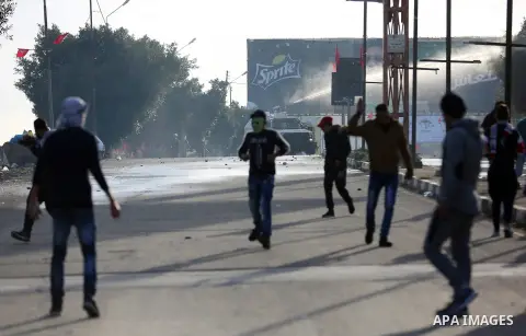 Palestinians throws stones at Israeli troops during clashes in Hawara checkpoint, south of the West Bank city of Nablus, following a demonstration against US President Donald Trump's decision to recognise Jerusalem as th...