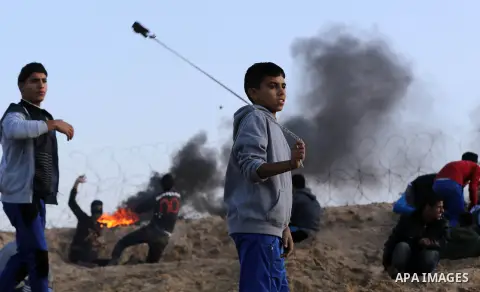 Palestinian protesters clash with Israeli forces at the Bureij refugee camp, in central Gaza on December 8, 2017. Palestinians clashed with Israeli security forces after calls for a "day of rage" as US President Donald T...