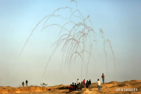 Palestinian protesters clash with Israeli forces at the Bureij refugee camp, in central Gaza on December 8, 2017. Palestinians clashed with Israeli security forces after calls for a "day of rage" as US President Donald T...