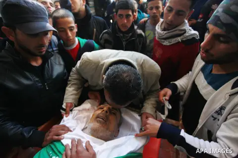 Relatives mourn over the body of Maher Atallah a 54-year-old Palestinian man who was killed the previous day in clashes with Israeli troops, during his funeral at the mosque, in Beit Lahia, in the northern Gaza Strip, on...