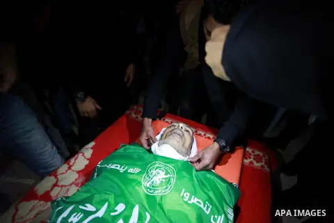 Relatives mourn over the body of Maher Atallah a 54-year-old Palestinian man who was killed the previous day in clashes with Israeli troops, during his funeral in Beit Lahia, in the northern Gaza Strip, on December 9, 20...