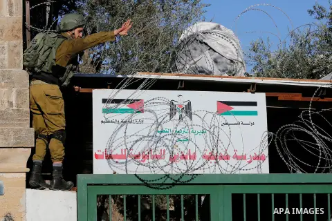Israeli forces walk down a street during clashes with Palestinian demonstrators in Hebron in the Israeli-occupied West Bank on December 9, 2017, following the US president's controversial recognition of Jerusalem as Isra...