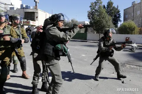 Israeli security forces intervene Palestinian protesters during a demonstration against U.S. President Donald Trump's recognition of Jerusalem as Israel's capital, in Bethlehem, West Bank on December 9, 2017. Photo by Wi...