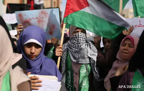 Palestinian students take part in a protest against US President Donald Trump's decision to recognise Jerusalem as the capital of Israel, in Gaza city on December 10, 2017. Photo by Ashraf Amra