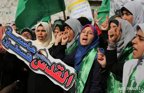 Palestinian students take part in a protest against US President Donald Trump's decision to recognise Jerusalem as the capital of Israel, in Gaza city on December 10, 2017. Photo by Ashraf Amra