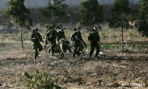 Israeli security forces chase Palestinian protestors during clashes in the West Bank town of Tulkarem, following a demonstration against US President Donald Trump's decision to recognise Jerusalem as the capital of Israe...