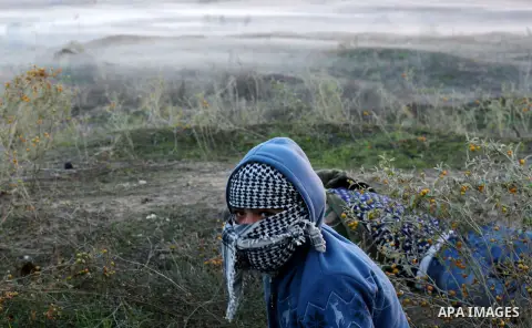 Palestinian protesters clash with Israeli secrity forces near the border fence with Israel, east of Gaza City on December 11, 2017 as demonstrations continue to flare in the Middle East and elsewhere over US President Do...