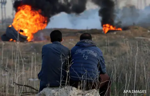 Palestinian protesters clash with Israeli secrity forces near the border fence with Israel, east of Gaza City on December 11, 2017 as demonstrations continue to flare in the Middle East and elsewhere over US President Do...