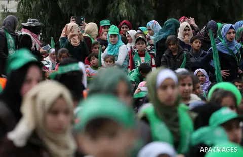 Palestinian Hamas supporters attend a rally marking the 30th anniversary of the founding of the Hamas movement, in Gaza city, December 14, 2017. Photo by Mohammed Asad