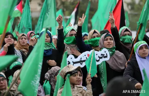 Palestinian Hamas supporters attend a rally marking the 30th anniversary of the founding of the Hamas movement, in Gaza city, December 14, 2017. Photo by Mohammed Asad