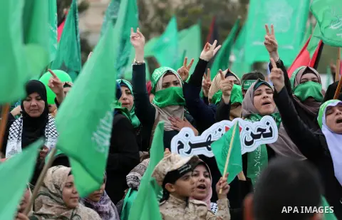 Palestinian Hamas supporters attend a rally marking the 30th anniversary of the founding of the Hamas movement, in Gaza city, December 14, 2017. Photo by Mohammed Asad