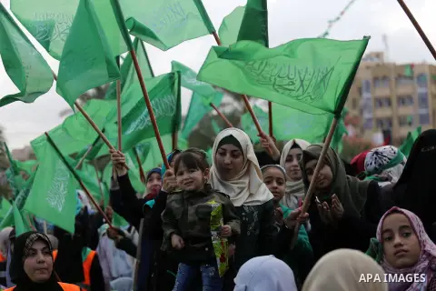 Palestinian Hamas supporters attend a rally marking the 30th anniversary of the founding of the Hamas movement, in Gaza city, December 14, 2017. Photo by Mohammed Asad