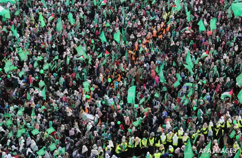 Palestinian Hamas supporters attend a rally marking the 30th anniversary of the founding of the Hamas movement, in Gaza city, December 14, 2017. Photo by Mohammed Asad