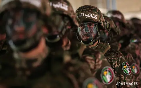 Palestinian members of the Qassam brigades, the militia wing of Hamas movement, attend a rally marking the 30th anniversary of their group, in Gaza City, Thursday, Dec. 14, 2017. Photo by Ashraf Amra
