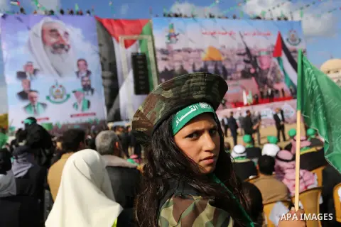 Palestinian Hamas supporters attend a rally marking the 30th anniversary of the founding of the Hamas movement, in Gaza city, December 14, 2017. Photo by Ashraf Amra