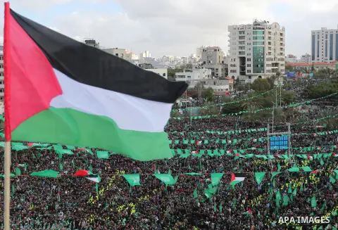 Palestinian Hamas supporters attend a rally marking the 30th anniversary of the founding of the Hamas movement, in Gaza city, December 14, 2017. Photo by Ashraf Amra