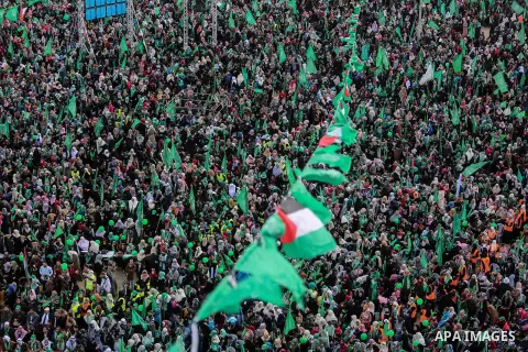 Palestinian Hamas supporters attend a rally marking the 30th anniversary of the founding of the Hamas movement, in Gaza city, December 14, 2017. Photo by Mohammed Dahman