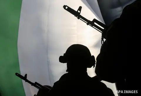 Armed members of the Qassam Brigades, the militia wing of Hamas movement, attend a rally marking the 30th anniversary of Hamas in Gaza City, Gaza, 14 December 2017. Photo by Mohammed Dahman
