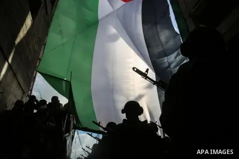 Armed members of the Qassam Brigades, the militia wing of Hamas movement, attend a rally marking the 30th anniversary of Hamas in Gaza City, Gaza, 14 December 2017. Photo by Mohammed Dahman