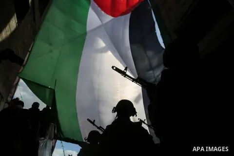 Armed members of the Qassam Brigades, the militia wing of Hamas movement, attend a rally marking the 30th anniversary of Hamas in Gaza City, Gaza, 14 December 2017. Photo by Mohammed Dahman