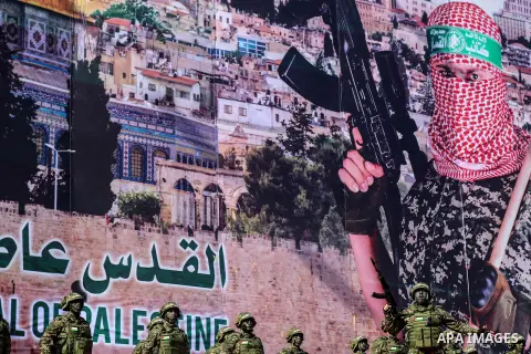 Armed members of the Qassam Brigades, the militia wing of Hamas movement, attend a rally marking the 30th anniversary of Hamas in Gaza City, Gaza, 14 December 2017. Photo by Mohammed Dahman