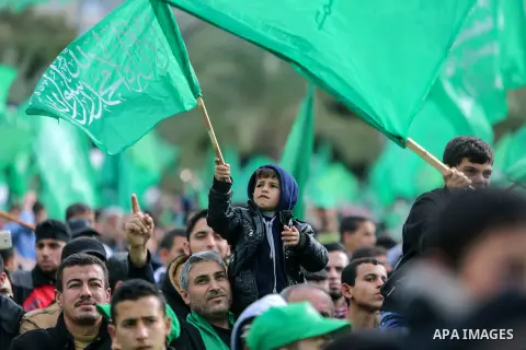 Palestinian Hamas supporters attend a rally marking the 30th anniversary of the founding of the Hamas movement, in Gaza city, December 14, 2017. Photo by Mohammed Dahman