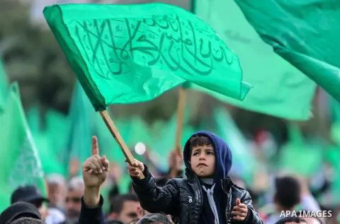Palestinian Hamas supporters attend a rally marking the 30th anniversary of the founding of the Hamas movement, in Gaza city, December 14, 2017. Photo by Mohammed Dahman
