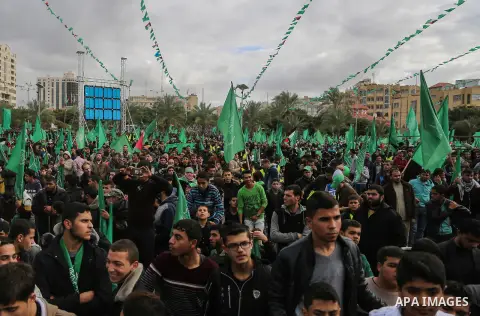 Palestinian Hamas supporters attend a rally marking the 30th anniversary of the founding of the Hamas movement, in Gaza city, December 14, 2017. Photo by Mohammed Dahman