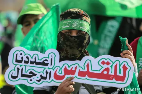 Palestinian Hamas supporters attend a rally marking the 30th anniversary of the founding of the Hamas movement, in Gaza city, December 14, 2017. Photo by Mohammed Dahman