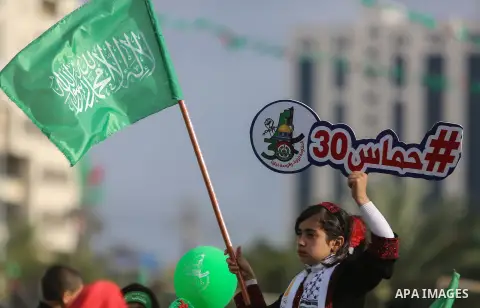 Palestinian Hamas supporters attend a rally marking the 30th anniversary of the founding of the Hamas movement, in Gaza city, December 14, 2017. Photo by Mohammed Dahman