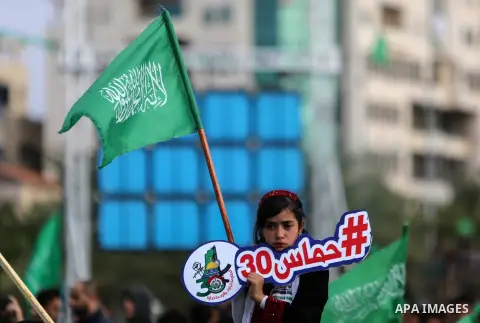 Palestinian Hamas supporters attend a rally marking the 30th anniversary of the founding of the Hamas movement, in Gaza city, December 14, 2017. Photo by Mohammed Dahman