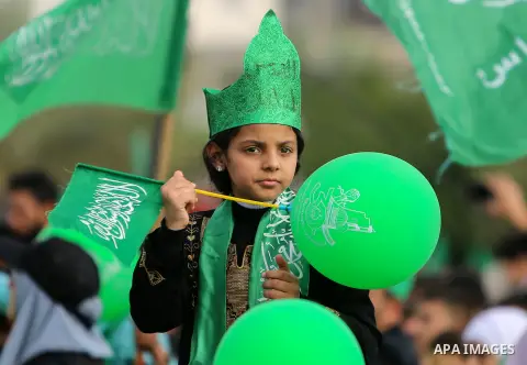 Palestinian Hamas supporters attend a rally marking the 30th anniversary of the founding of the Hamas movement, in Gaza city, December 14, 2017. Photo by Mohammed Dahman