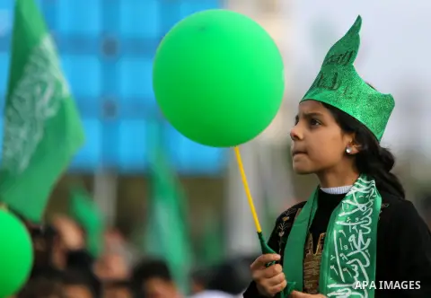 Palestinian Hamas supporters attend a rally marking the 30th anniversary of the founding of the Hamas movement, in Gaza city, December 14, 2017. Photo by Mohammed Dahman