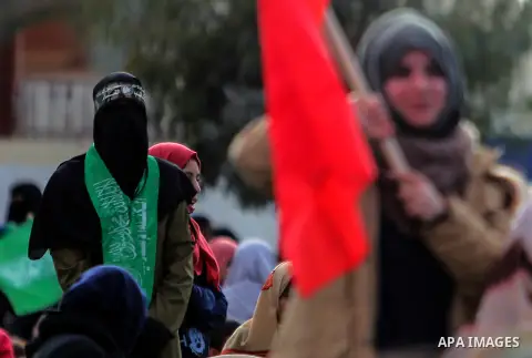 Palestinian Hamas supporters attend a rally marking the 30th anniversary of the founding of the Hamas movement, in Gaza city, December 14, 2017. Photo by Mohammed Dahman