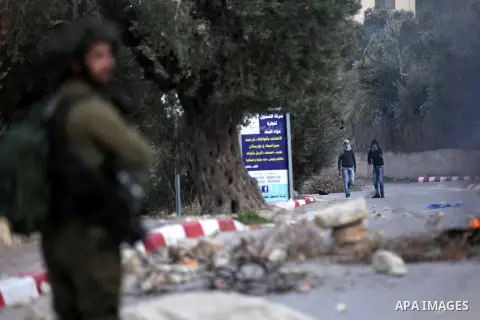 Palestinian protestors, from the nearby Palestinian village of Naqura, confront Israeli security forces close to the Jewish settlement of Shavei Shomron near the West Bank city of Tulkarem on December 14, 2017, as protes...