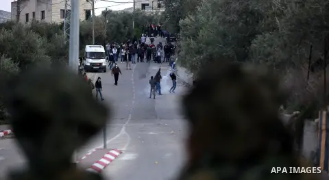 Palestinian protestors, from the nearby Palestinian village of Naqura, confront Israeli security forces close to the Jewish settlement of Shavei Shomron near the West Bank city of Tulkarem on December 14, 2017, as protes...