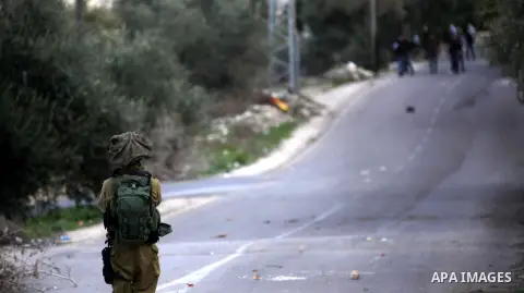 Palestinian protestors, from the nearby Palestinian village of Naqura, confront Israeli security forces close to the Jewish settlement of Shavei Shomron near the West Bank city of Tulkarem on December 14, 2017, as protes...