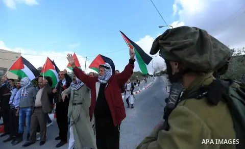 Palestinian protestors, from the nearby Palestinian village of Naqura, confront Israeli security forces close to the Jewish settlement of Shavei Shomron near the West Bank city of Tulkarem on December 14, 2017, as protes...