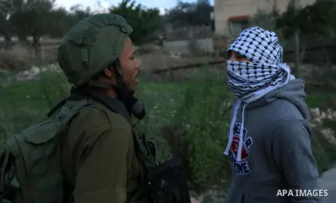 Palestinian protestors, from the nearby Palestinian village of Naqura, confront Israeli security forces close to the Jewish settlement of Shavei Shomron near the West Bank city of Tulkarem on December 14, 2017, as protes...