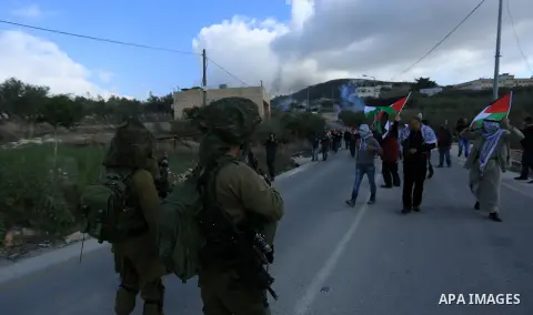 Palestinian protestors, from the nearby Palestinian village of Naqura, confront Israeli security forces close to the Jewish settlement of Shavei Shomron near the West Bank city of Tulkarem on December 14, 2017, as protes...