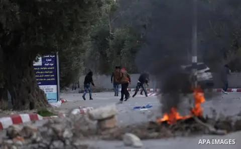 Palestinian protestors, from the nearby Palestinian village of Naqura, confront Israeli security forces close to the Jewish settlement of Shavei Shomron near the West Bank city of Tulkarem on December 14, 2017, as protes...